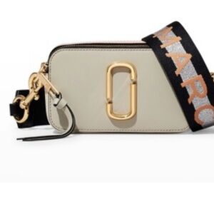 Cream and light pink. Brand new. Has duster bag as well.